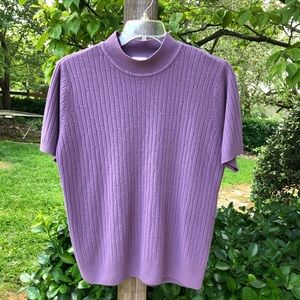 Very nice purple sweater.